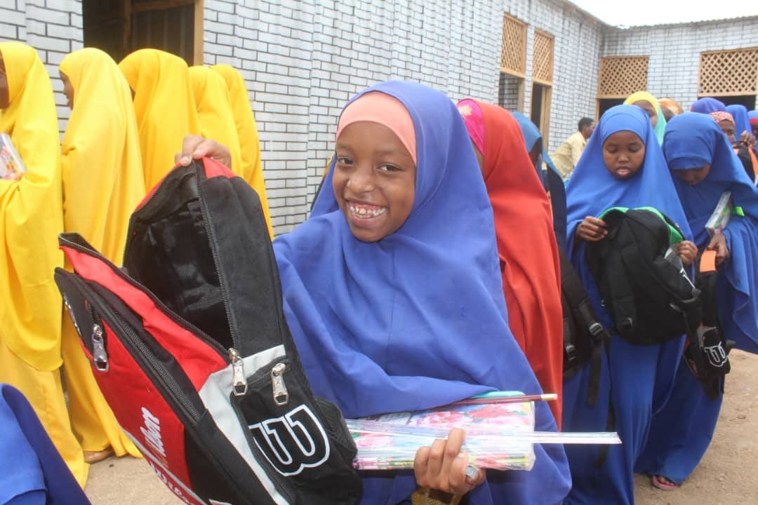 Distributing School Materials for Girls